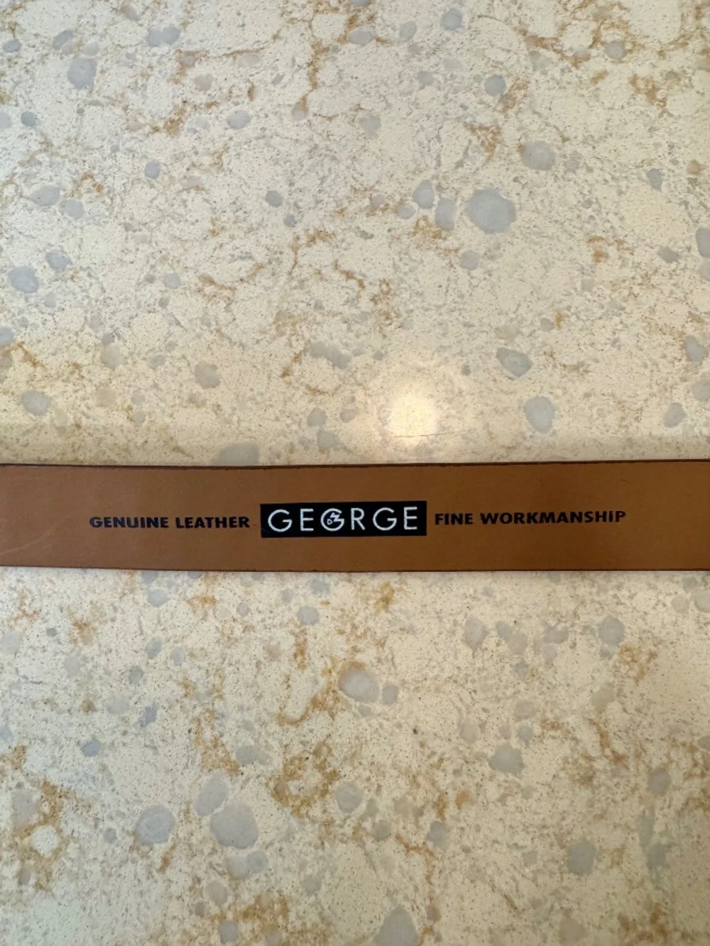 Men's size 44 100% unique leather belt by George, silver metal buckle.
